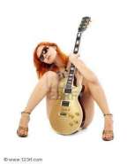 1180167-lovely-redhead-with-golden-guitar-over-white.jpg