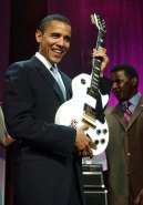 barack-obama-at-the-time-still-an-illinois-senator-holds-a-gibson-guitar-presen.jpg