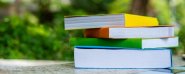 yellow-orange-green-blue-book-placed-on-the-table-knowledge-books-and-educational-concepts_532405-548.jpg
